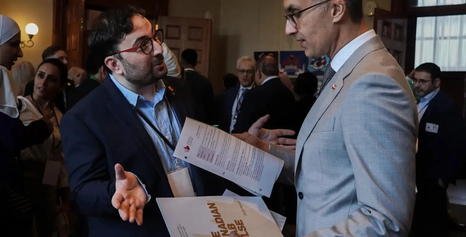 Hamza Arsbi in conversation at Queen’s Park, presenting research